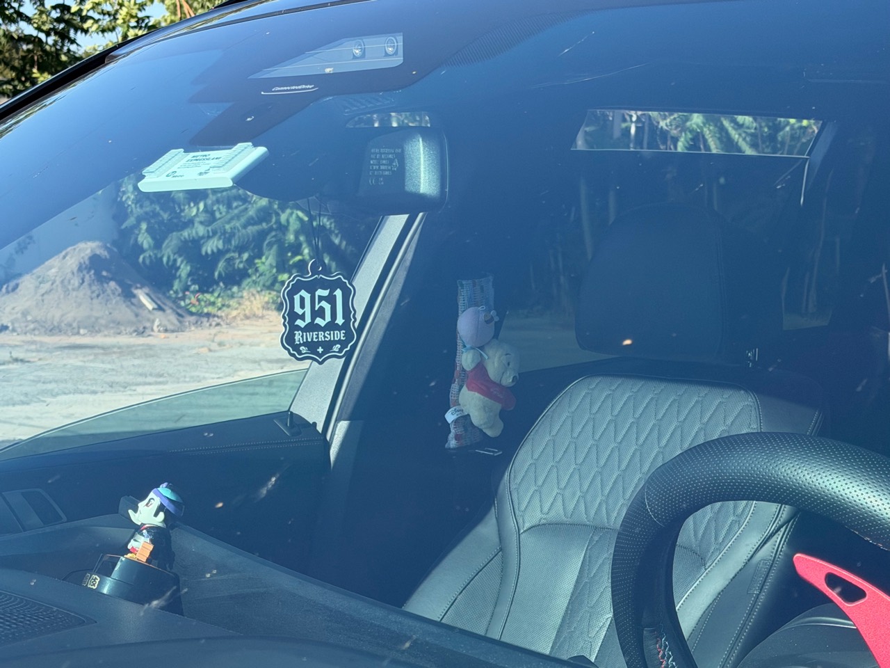 951 Riverside air freshener visible through a car windshield