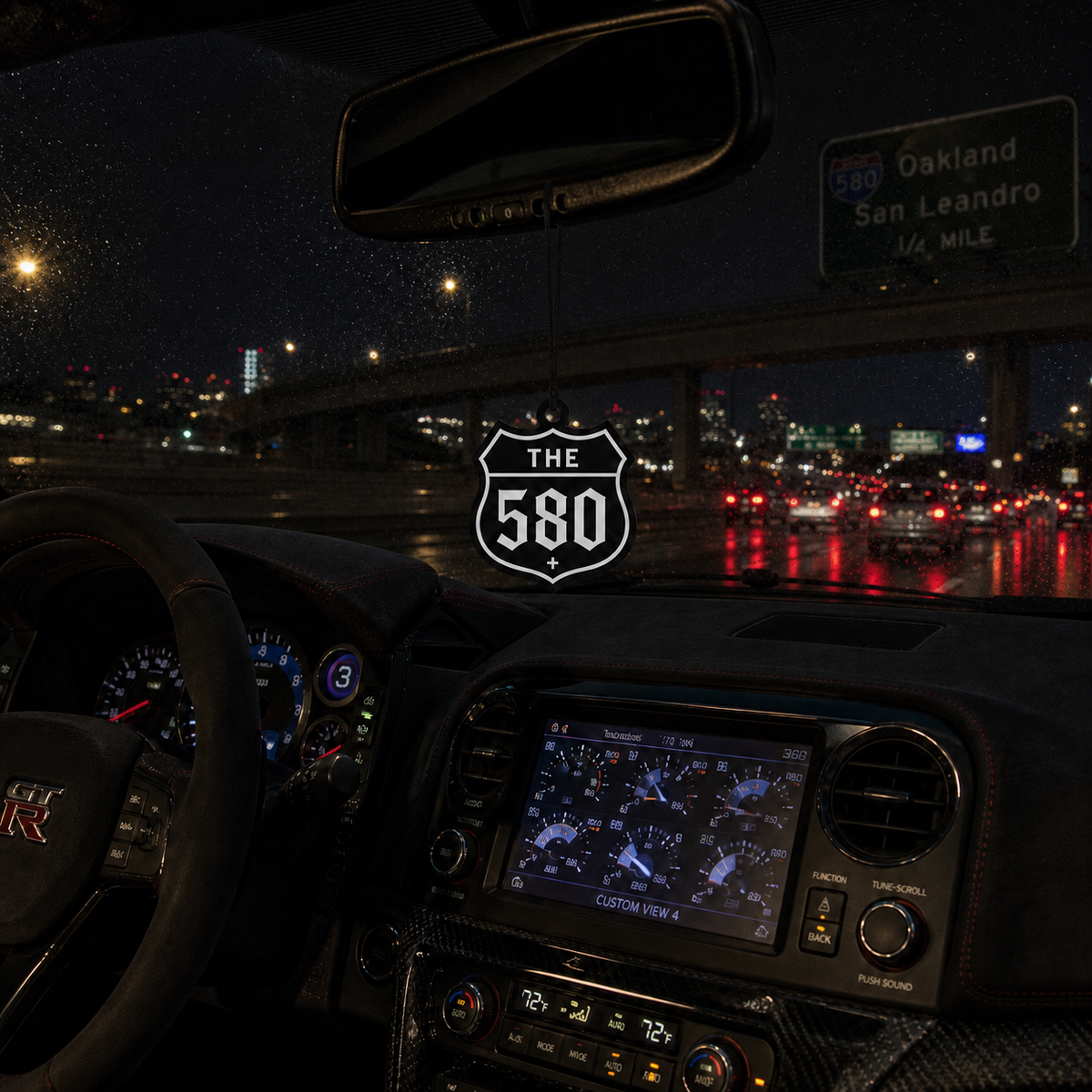 The 580 car air freshener in a nighttime car interior