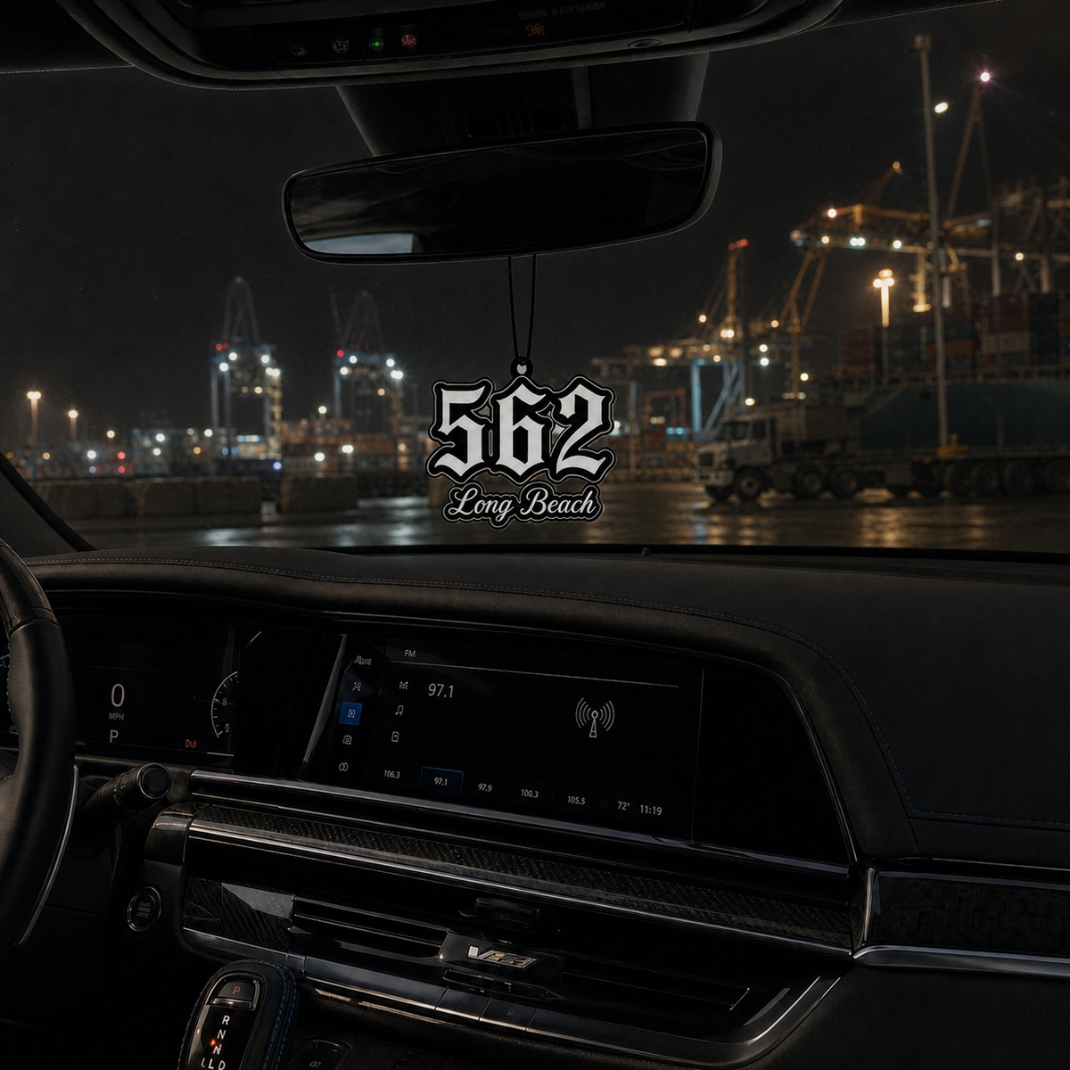 562 Long Beach car air freshener in a nighttime car interior