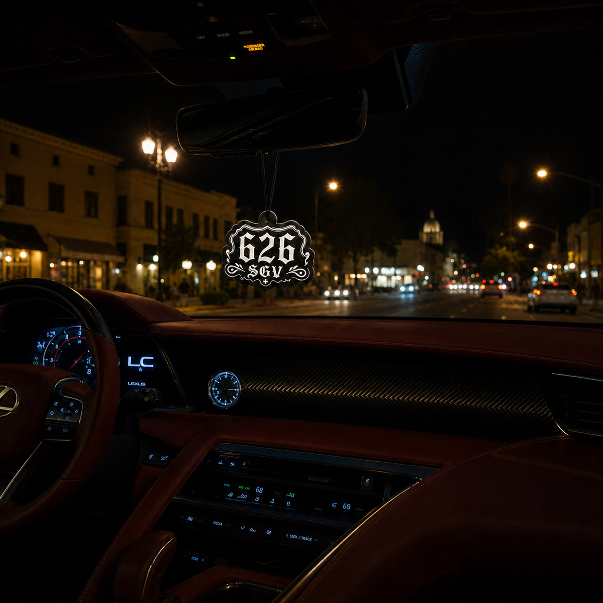 626 SGV car air freshener in a nighttime car interior