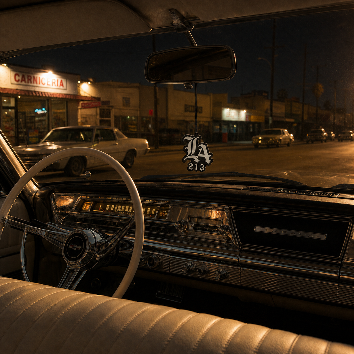 LA 213 car air freshener in a nighttime car interior
