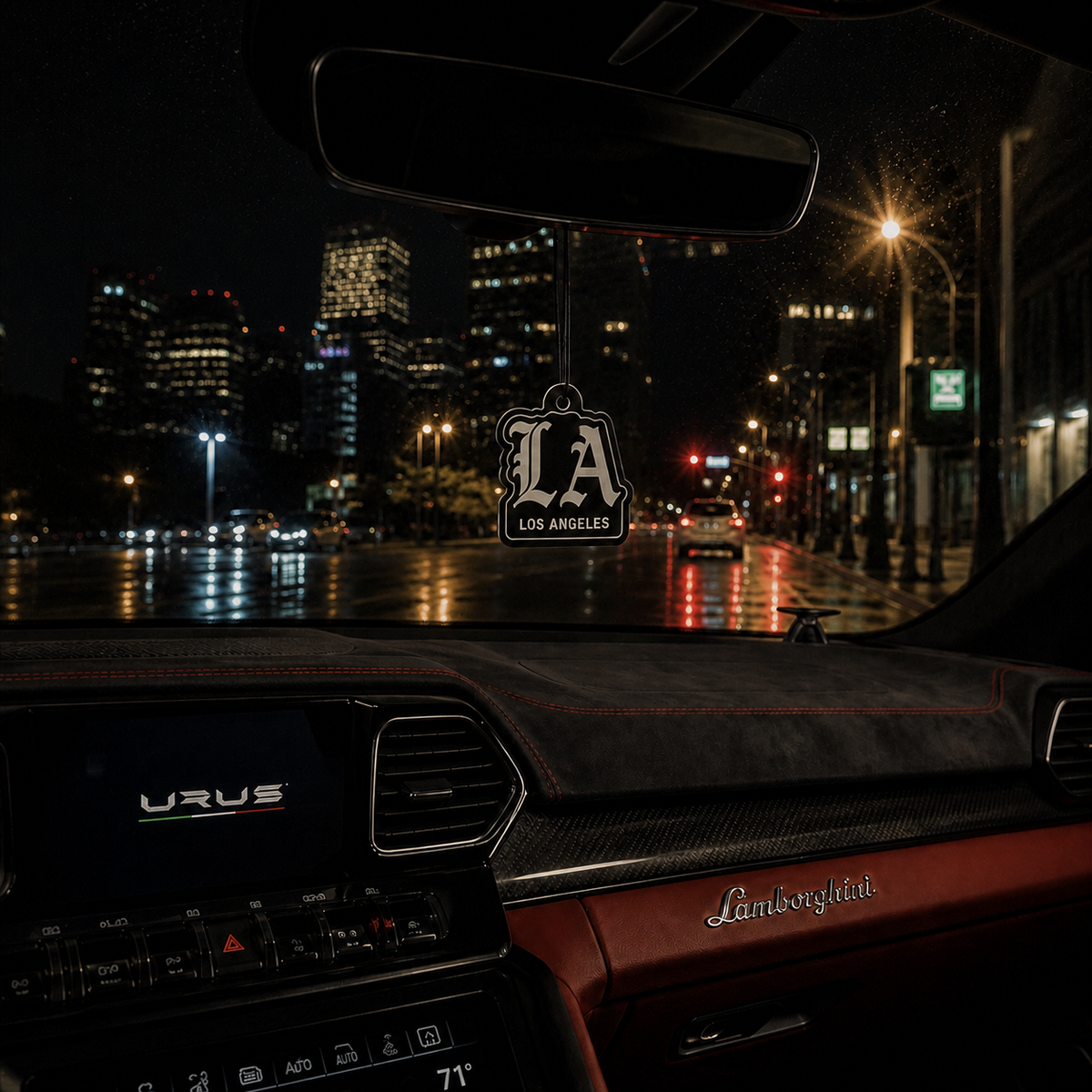 LA Los Angeles car air freshener in a nighttime car interior